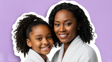 Mother and daughter in white spa robes smiling together, promoting the Total Treat manicure and pedicure package